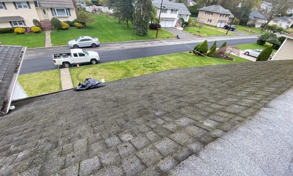 an after photo of a home roof after roof cleaning